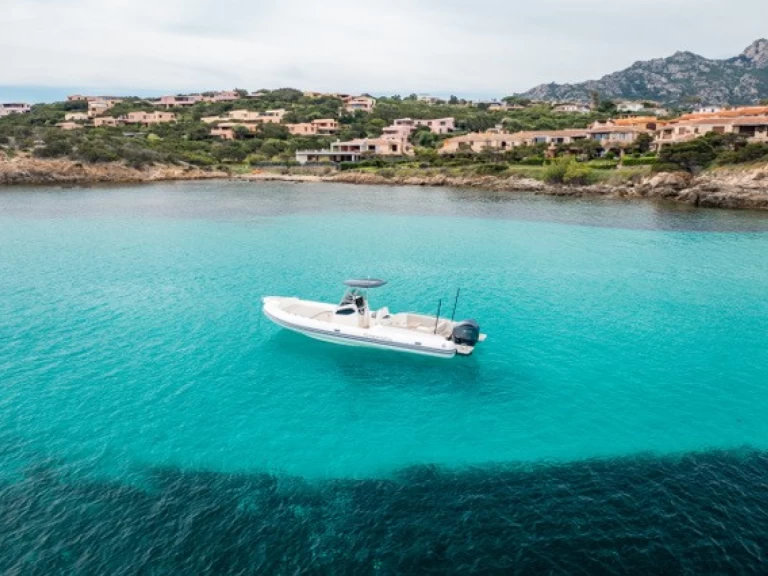  Capelli 900 Open 300 HP charter bareboat or skippered in  Poltu Quatu