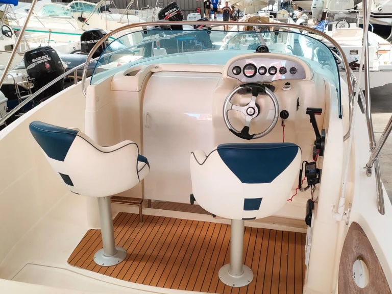 Rio Rio 750 Sol charter bareboat or skippered in  Club Nàutic Ca'n Picafort