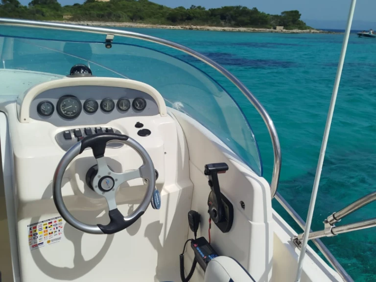 Rio Rio 750 Sol charter bareboat or skippered in  Club Nàutic Ca'n Picafort