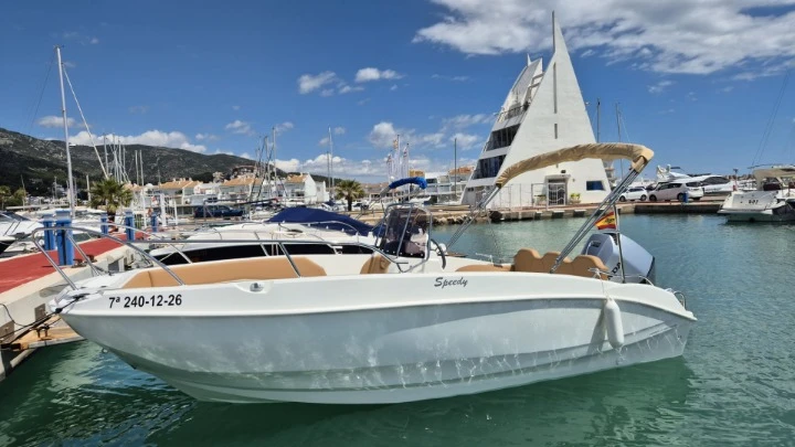 Cayman 585 charter bareboat or skippered in  Cala Galdana